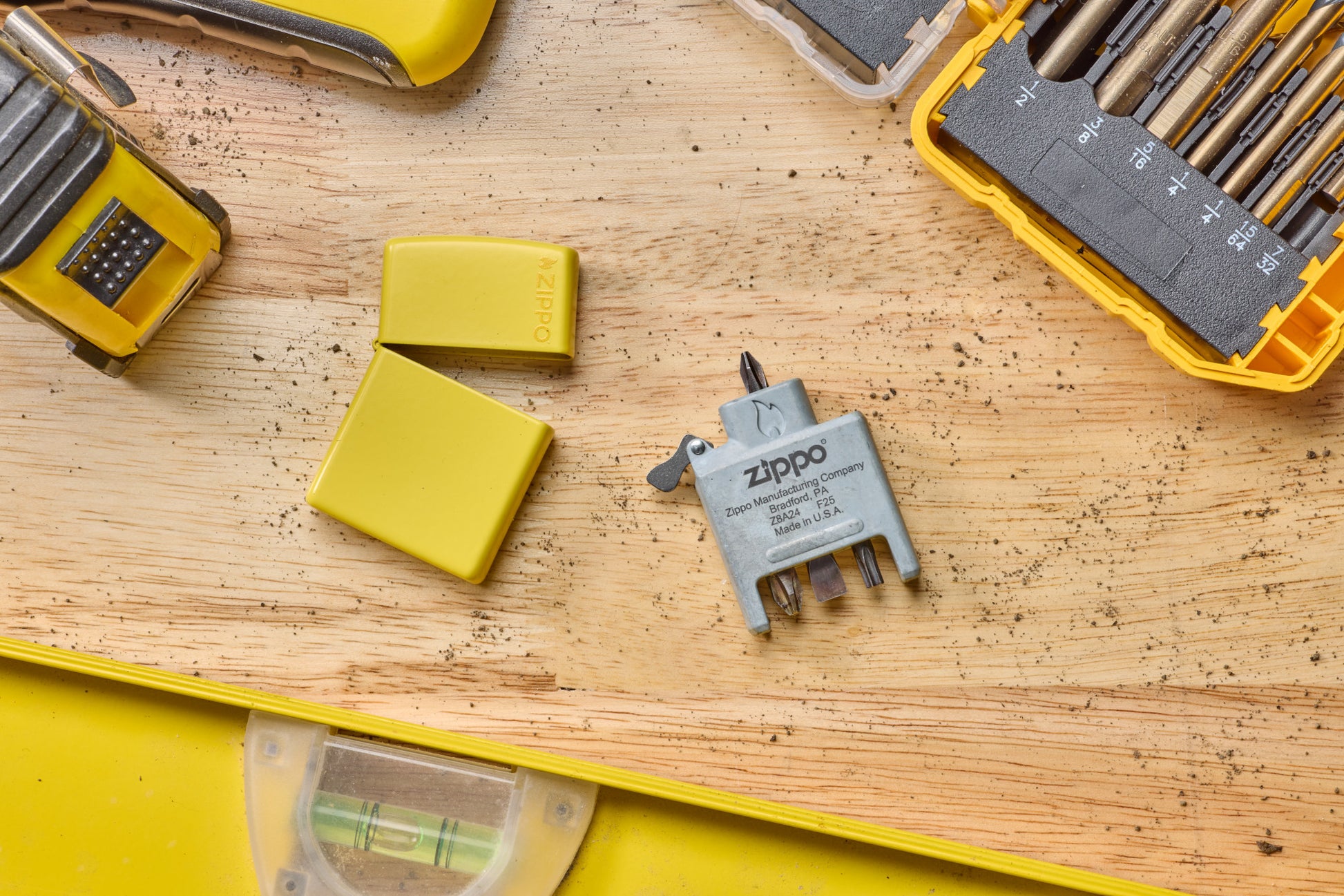 Lifestyle Image of Bit Safe Screwdriver USA laying on wood worktable with sunflower case and tools.
