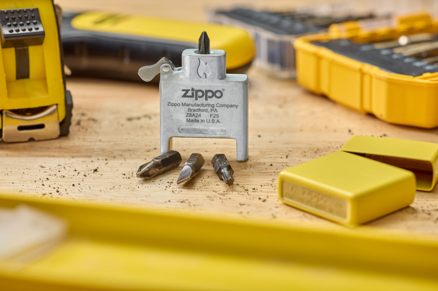 Lifestyle Image of Bit Safe Screwdriver USA standing on wood worktable with sunflower case and tools in the background.