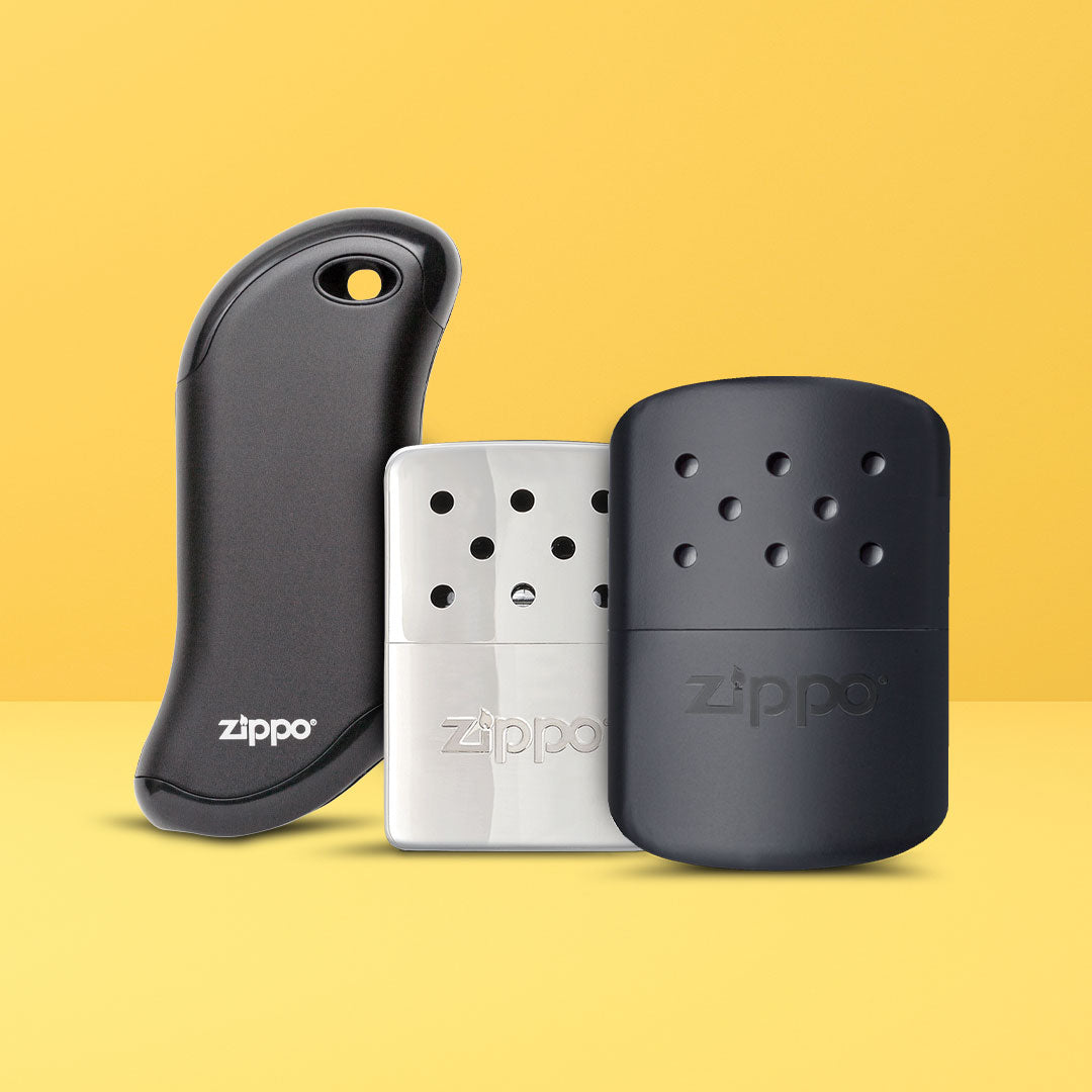 Three Zippo hand warmers on a yellow background