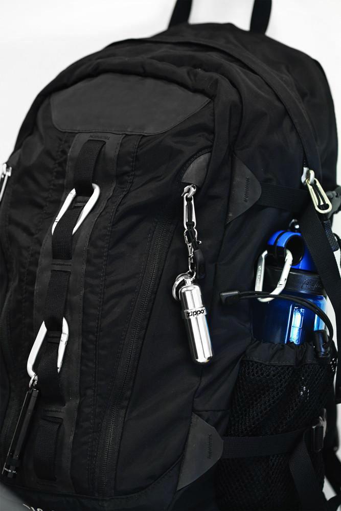 Front view of the Zippo Fuel Canister attached to a backpack