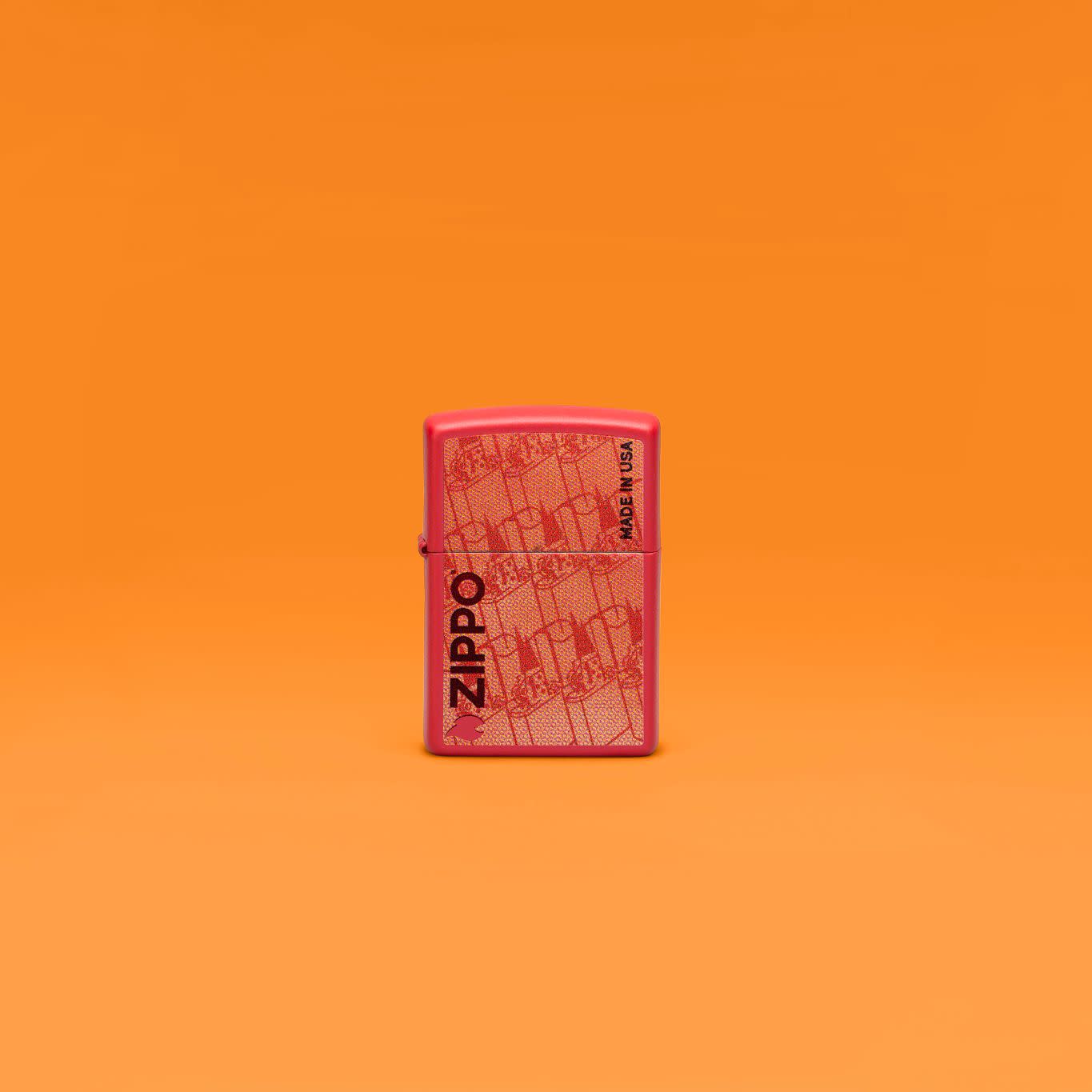 Lifestyle image of Zippo Made in USA Design Red Matte Windproof Lighter in an orange scene.