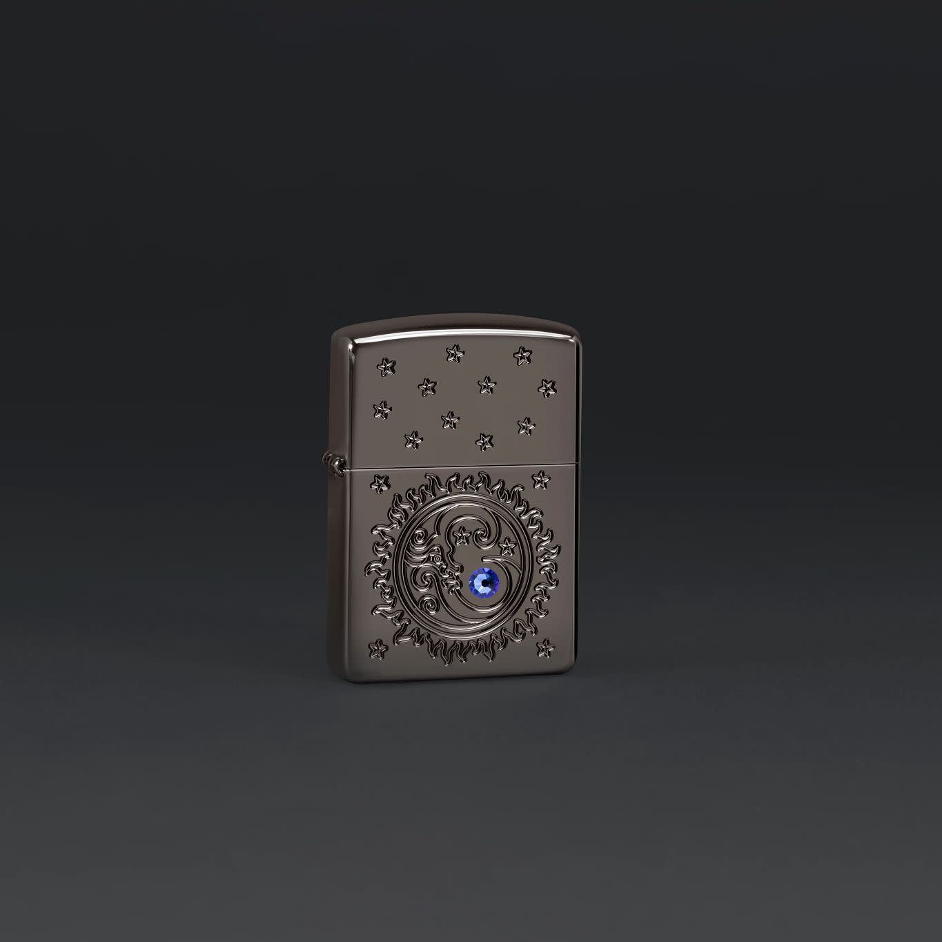 Lifestyle image of Zippo Ocean Crystal Black Ice® Windproof Lighter on a dark grey background.