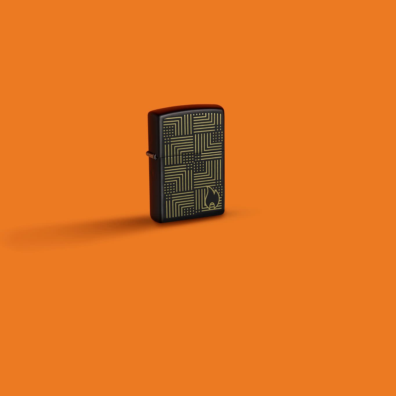 Lifestyle image of Zippo Reflection Design Black Matte Windproof Lighter in an orange scene.