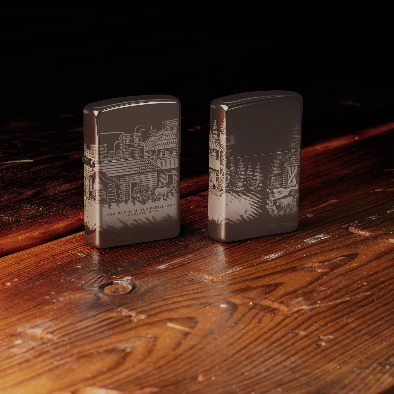 Lifestyle image of two Zippo Jack Daniel's® Distillery Design Black Ice® Windproof Lighters; one showing the front of the lighter and the other showing the back and hinge side of the lighter, both standing on a distressed wooden workbench with a black background.