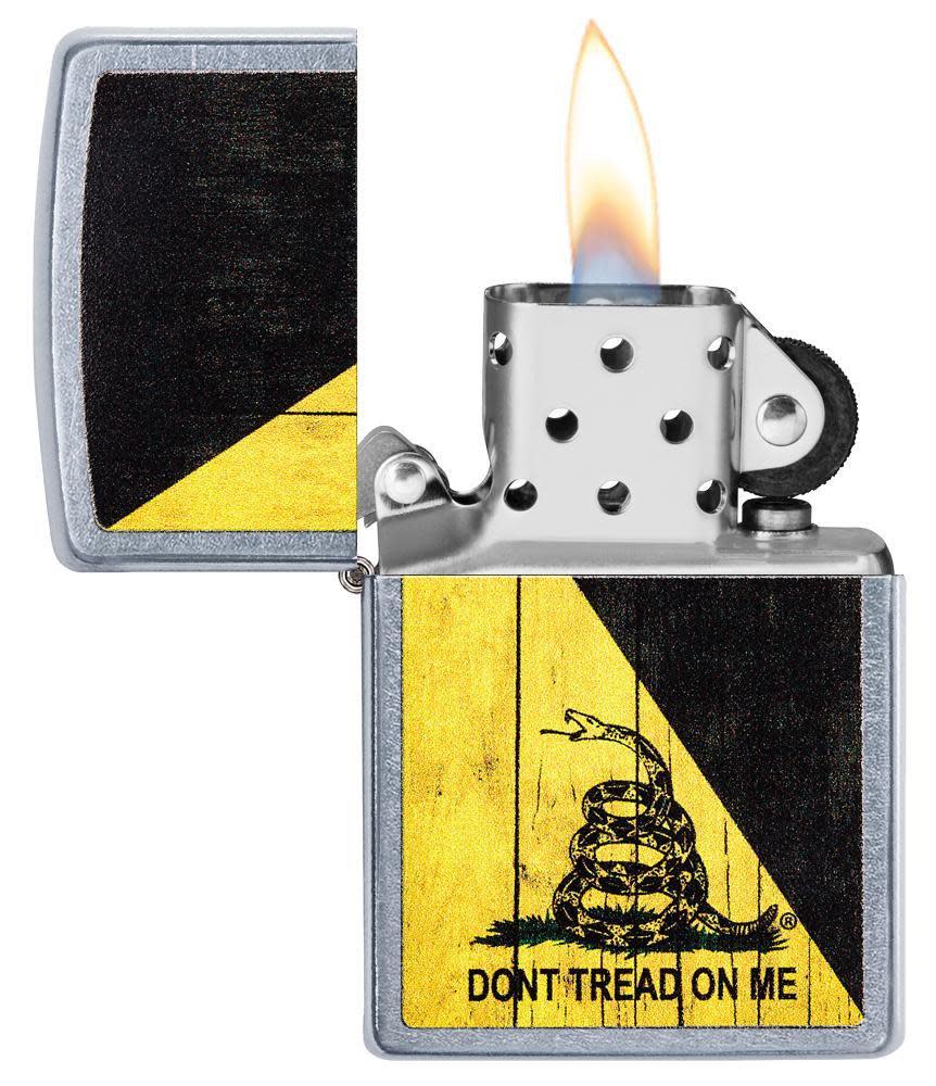 Front view of the Don't Tread on Me Lighter open and lit