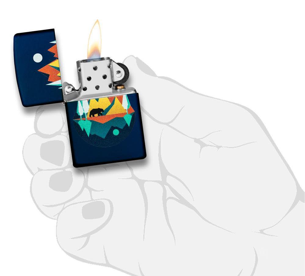 Front view of the Geometric Bear and Mountains Design Lighter, in hand, open and lit