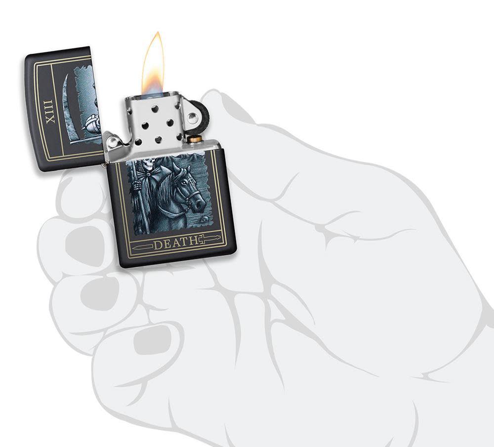 Front view of the Death Card Design Lighter open, in hand and lit