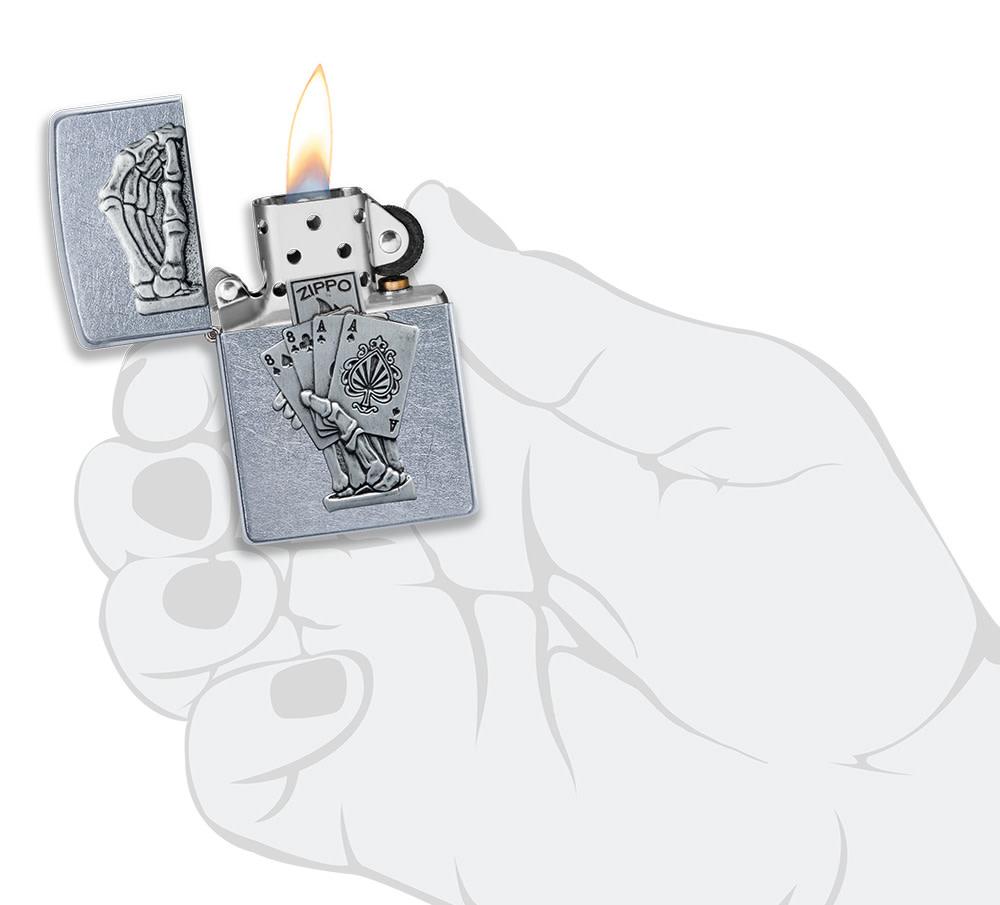 Dead Mans Hand Surprise Emblem Design Street Chromeâ„¢ Windproof Lighter lit in hand