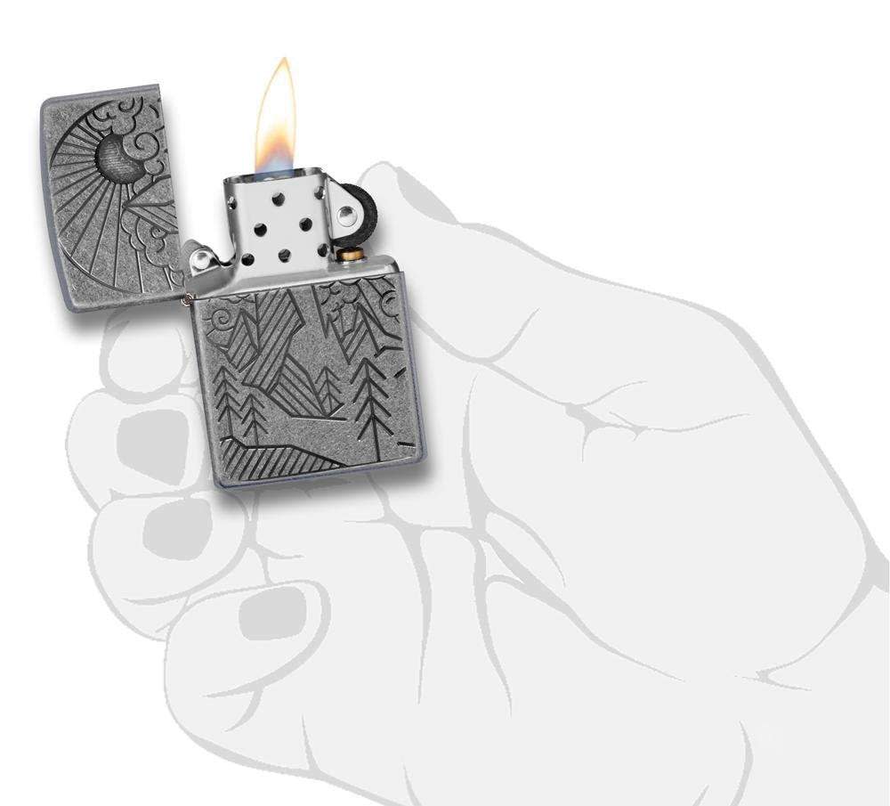 Armor® Antique Silver Mountain Design Windproof Lighter lit in hand