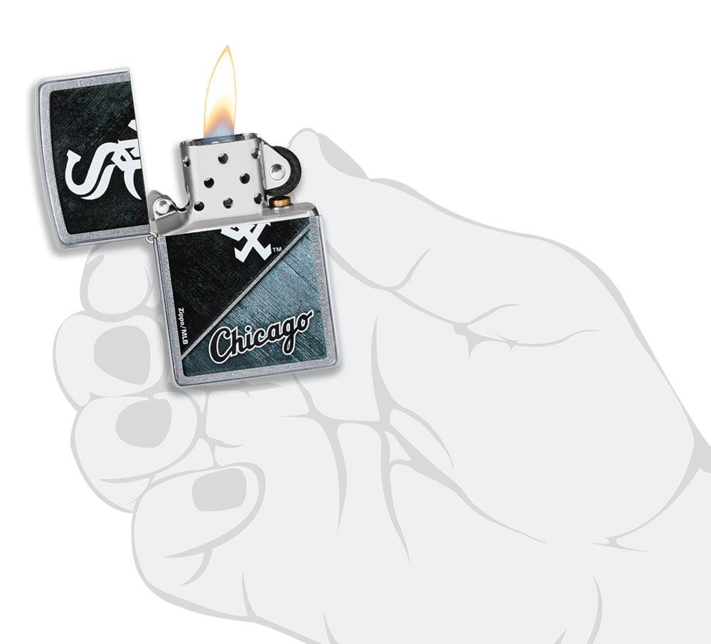 MLB® Chicago White Sox™ Street Chrome™ Windproof Lighter lit in hand.