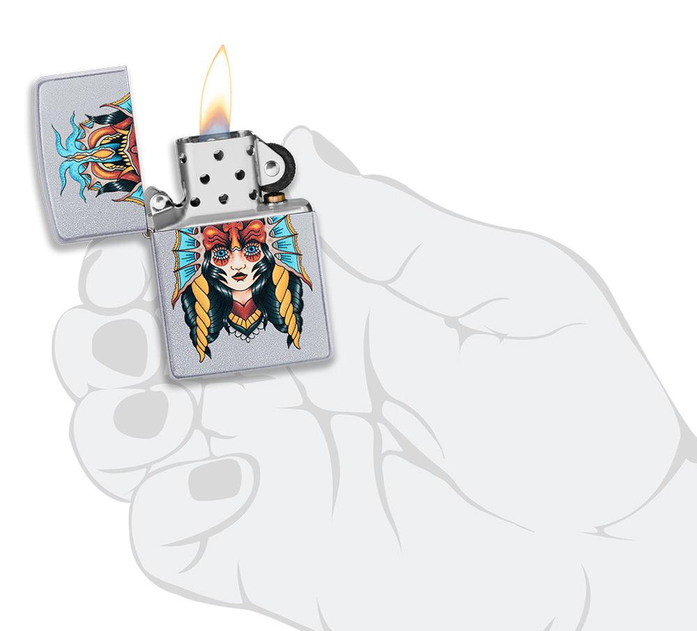 Front View of the Two Face Design Lighter in hand, open and lit