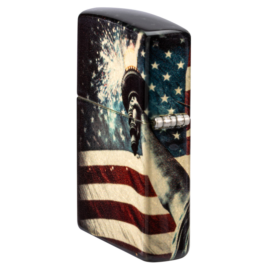 Angled shot of  Zippo Spark of Liberty Design 540 Tumbled Brass Windproof Lighter showing the back and hinge side of the lighter.