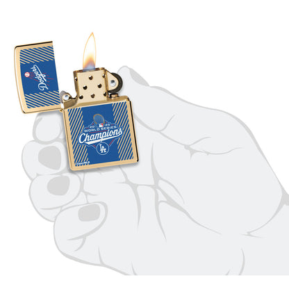 Zippo 2025 World Series™ Champions Commemorative High Polish Brass Windproof Lighter lit in hand.