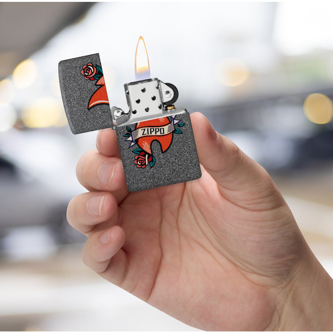 Zippo Flame Tattoo Design Iron Stone Windproof Lighter lit in hand.