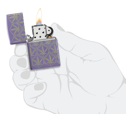 Zippo Honeycomb Cannabis Design Smoky Lavender Windproof Lighter lit in hand.