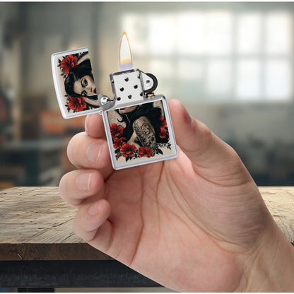 Zippo Pinup Tattoo Design Satin Chrome Windproof Lighter lit in hand.