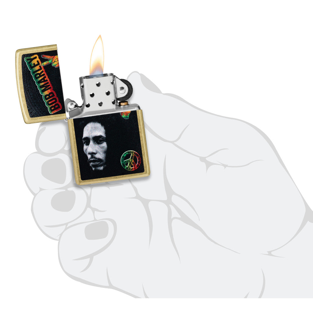 Zippo Bob Marley Peace Design Street Brass Windproof Lighter lit in hand.
