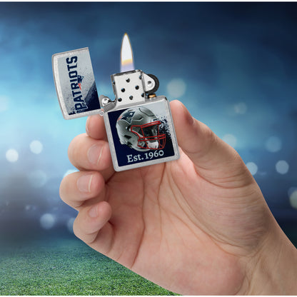 Zippo NFL New England Patriots Helmet Design Street Chrome Windproof Lighter lit in hand.