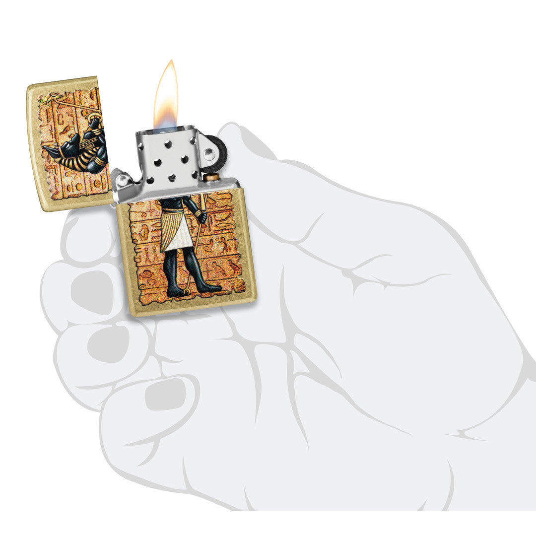 Zippo Guardian of Tombs Design Street Brass Windproof Lighter lit in hand.