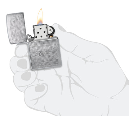 Zippo James Bond® Tuxedo Design Brushed Chrome Windproof Lighter lit in hand.