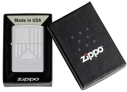 Zippo Folds of Honor Etched Flag Design High Polish Chrome Windproof Lighter in its packaging.