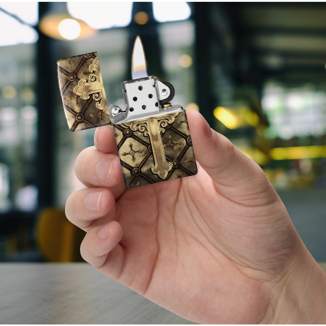 Zippo Gilded Cross Design 540 Tumbled Brass Windproof Lighter lit in hand.