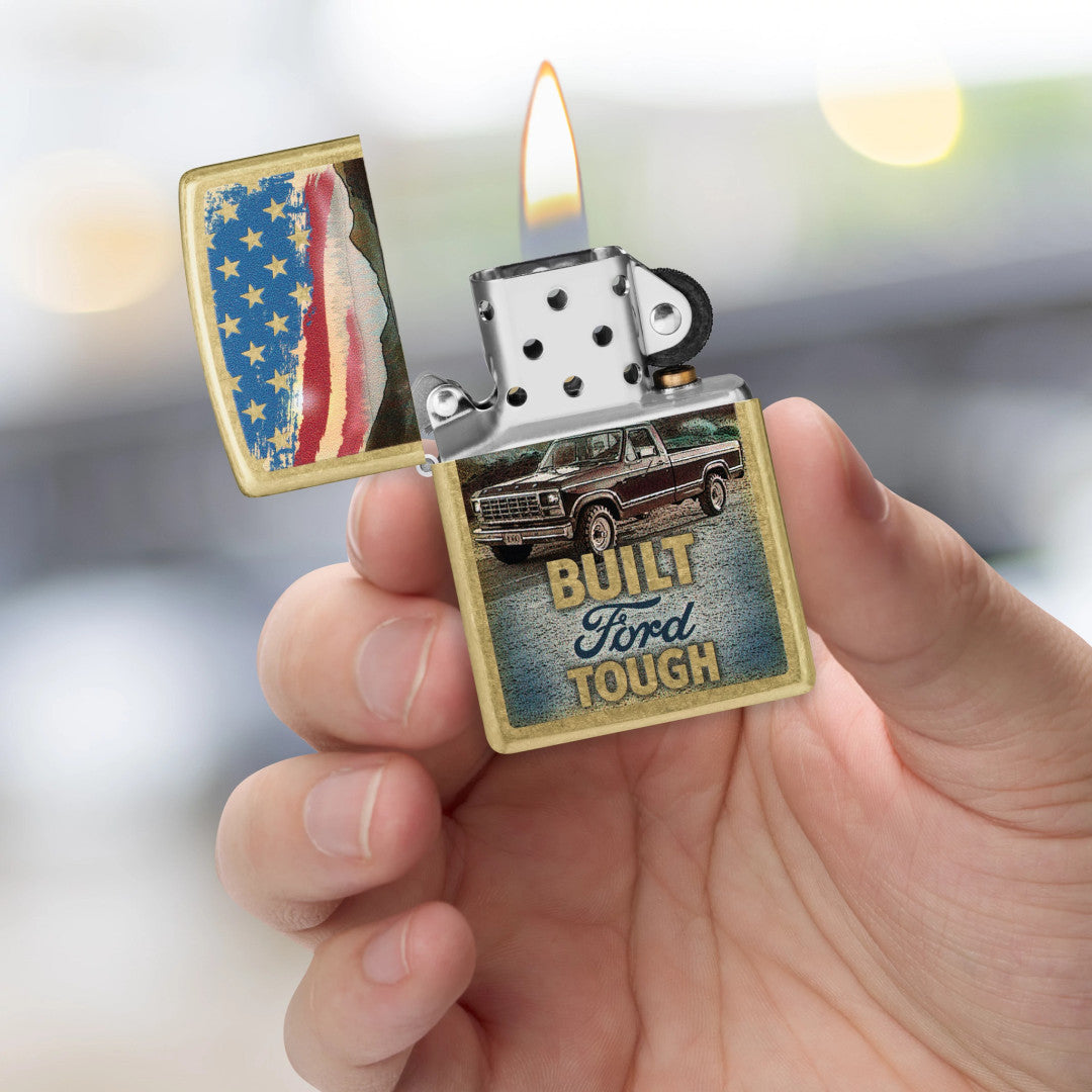 Zippo Built Ford Tough Design Street Brass Windproof Lighter lit in hand.