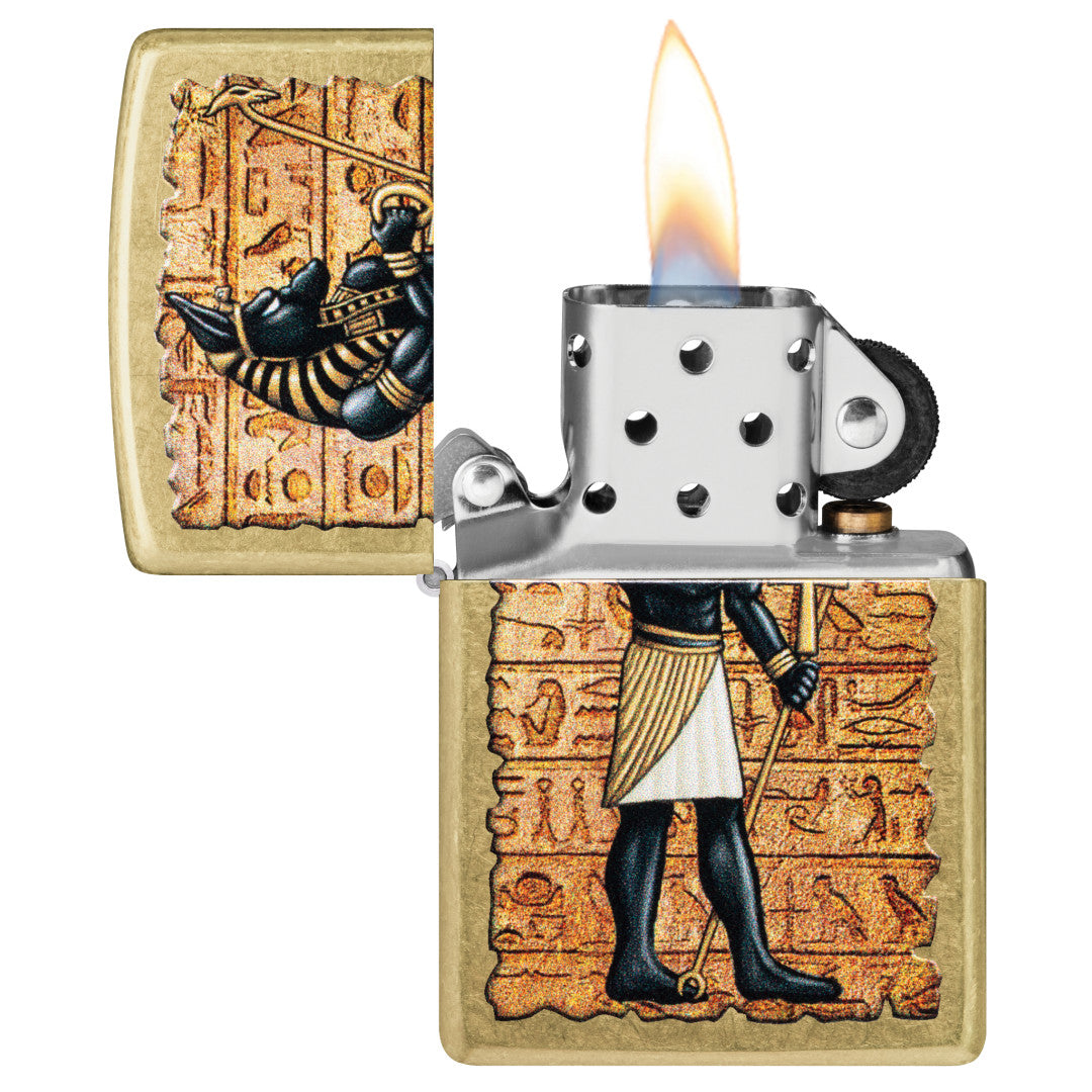 Zippo Guardian of Tombs Design Street Brass Windproof Lighter with its lid open and lit.
