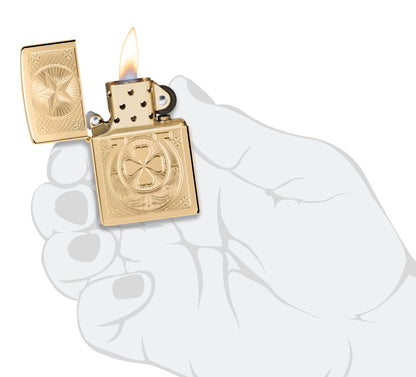 Zippo Lucky Horseshoe Design High Polish Brass Windproof Lighter lit in hand.