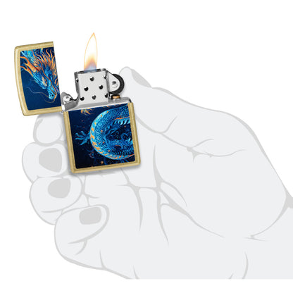 Zippo Sea Dragon Design Street Brass Windproof Lighter lit in hand.