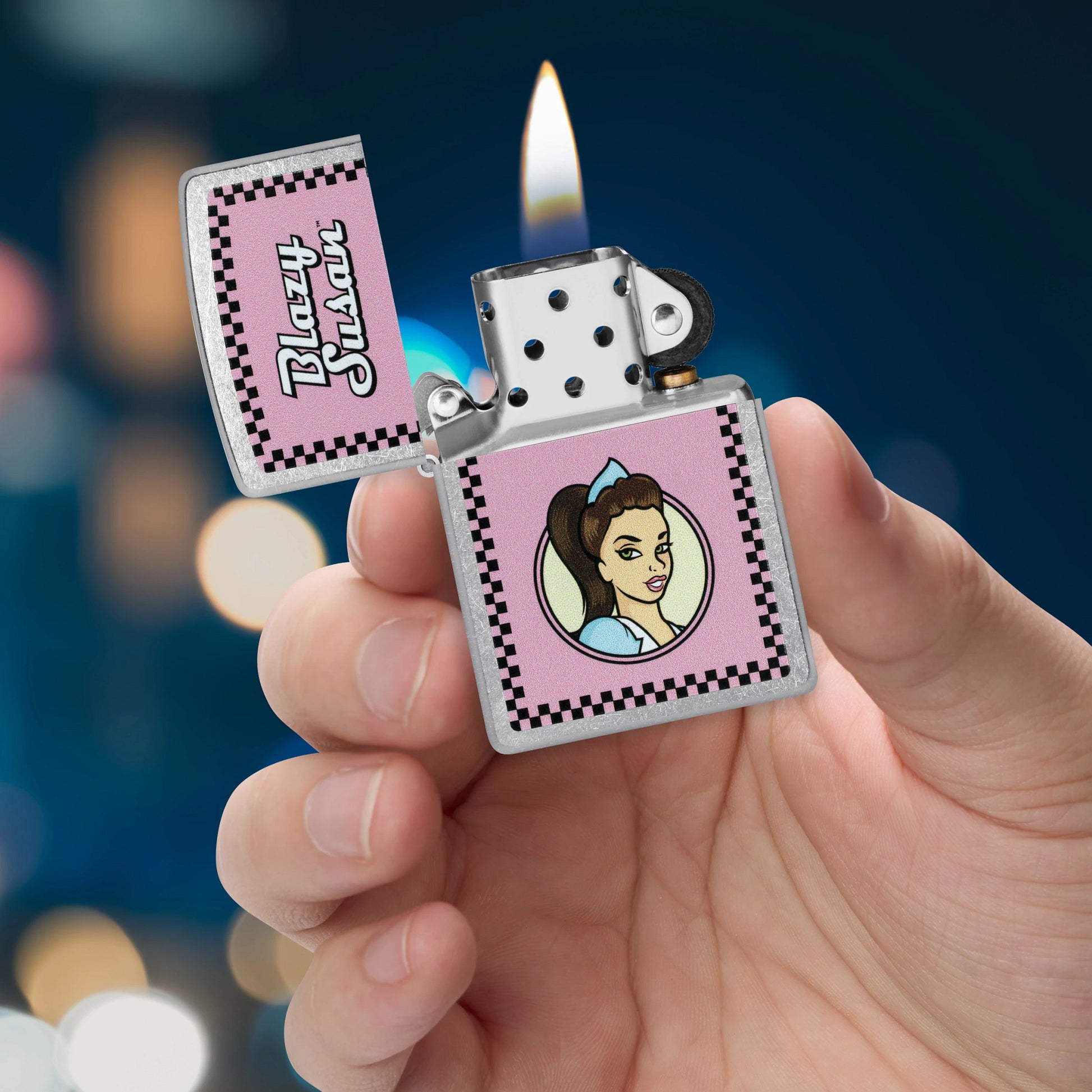 Zippo Blazy Susan™ Checker Design Street Chrome Windproof Lighter lit in hand.