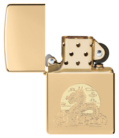 Zippo Moon Dragon Design High Polish Brass Windproof Lighter with its lid open and unlit.