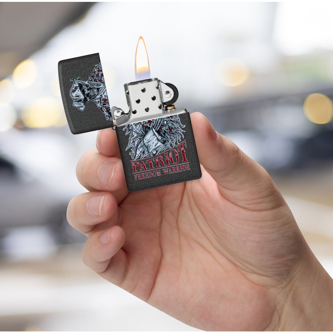 Zippo Freedom Warrior Design Black Crackle® Windproof Lighter lit in hand.