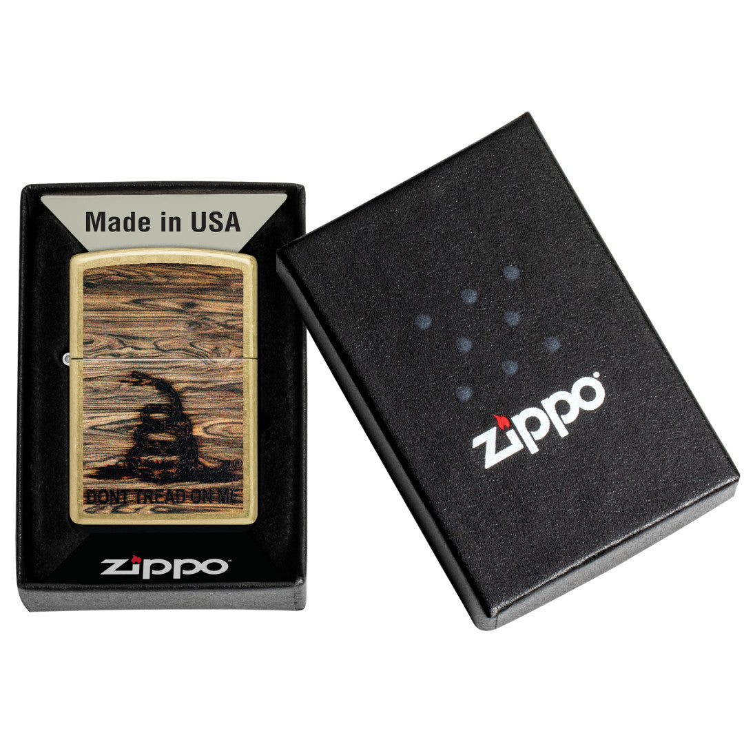 Zippo Don't Tread On Me® Woodburn Design Street Brass Windproof Lighter in its packaging.