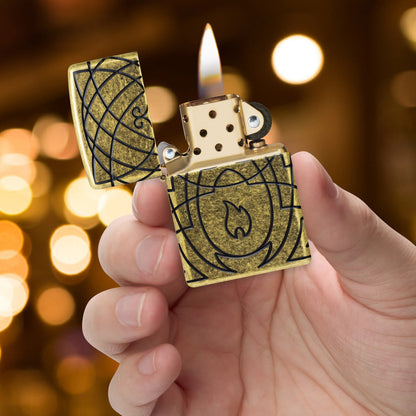 Zippo Celtic Flame Design Armor® Antique Brass Windproof Lighter lit in hand.