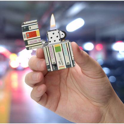 Zippo Home Video Design 540 Matte Windproof Lighter lit in hand.