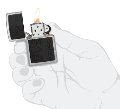 Zippo Black Leather Emblem - Zippo Design Street Chrome Windproof Lighter lit in hand.
