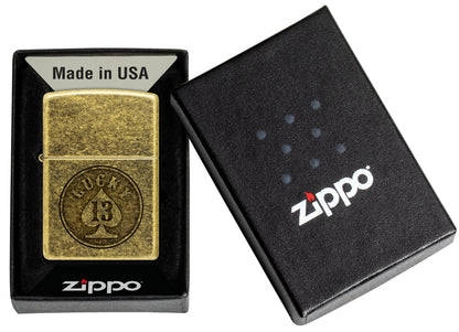 Zippo Lucky 13 Design Antique Brass Windproof Lighter in its packaging.