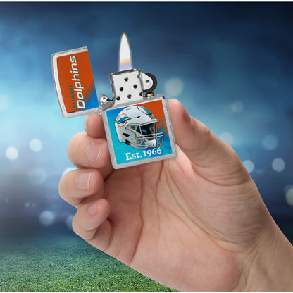Zippo NFL Miami Dolphins Helmet Design Street Chrome Windproof Lighter lit in hand.
