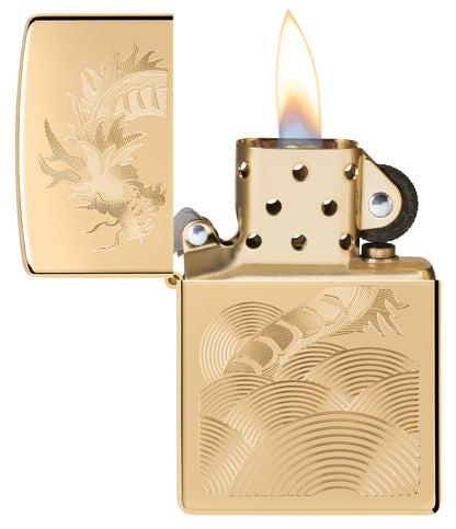 Zippo Golden Dragon Design High Polish Brass Windproof Lighter with its lid open and lit.