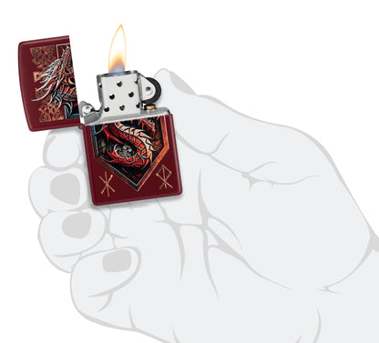 Zippo Dragon Shield Design Merlot Windproof Lighter lit in hand.