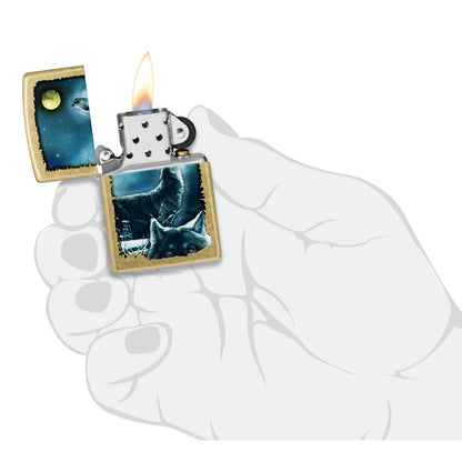 Zippo Wolf Song Design Street Brass Windproof Lighter lit in hand.