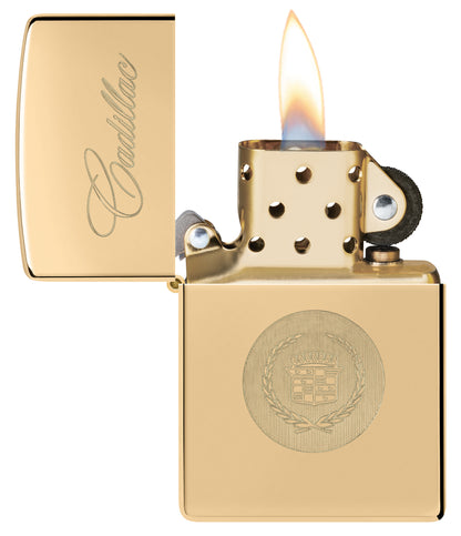 Zippo Cadillac® Crest  High Polish Brass Windproof Lighter with its lid open and lit.