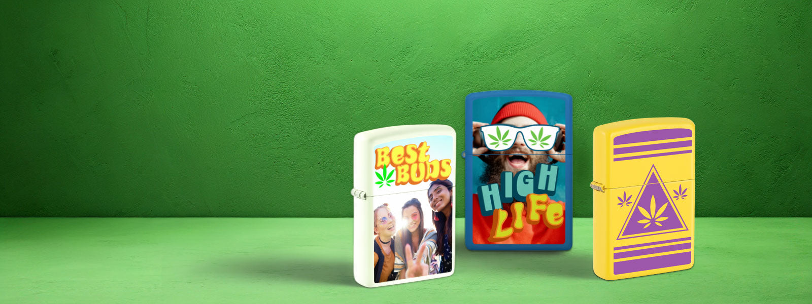 Three Zippo lighters on a green background.