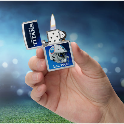 Zippo NFL Tennessee Titans Helmet Design Street Chrome Windproof Lighter lit in hand.