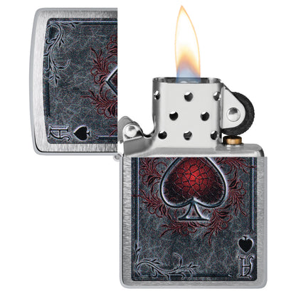 Zippo Antiqued Ace Design Brushed Chrome Windproof Lighter with its lid open and lit.