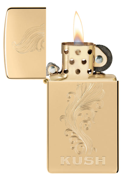 Zippo Slim® Kush Design High Polish Brass Windproof Lighter with its lid open and lit.