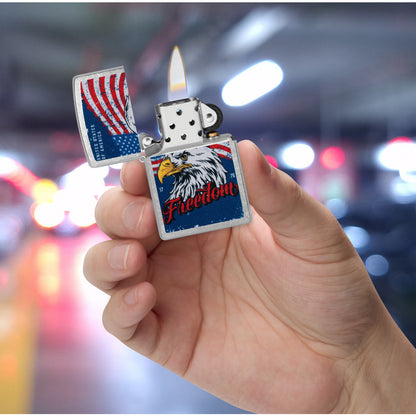 Zippo Freedom Eagle Design Street Chrome Windproof Lighter lit in hand.