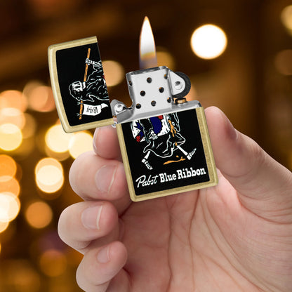 Zippo Pabst Blue Ribbon® Reaper Design Street Brass Windproof Lighter lit in hand.