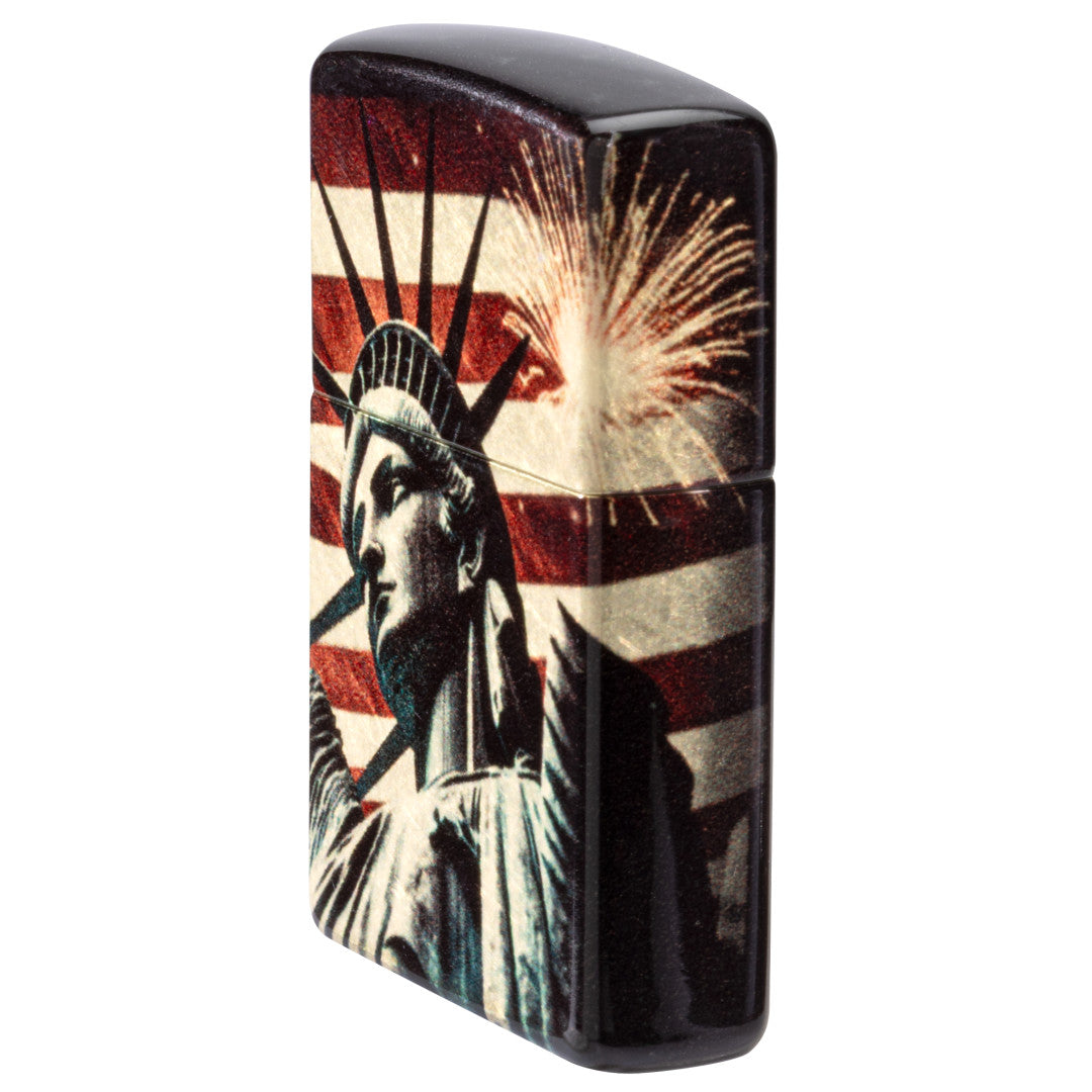 Angled shot of  Zippo Spark of Liberty Design 540 Tumbled Brass Windproof Lighter showing the front and non-hinge side of the lighter.